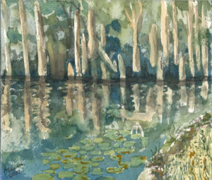 Watercolor painting of a pond with lily pads, tree reflections, grass, and vegetation signed 2022
